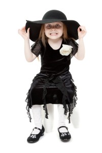 3729605-the-little-girl-hamming-in-a-black-felt-hat